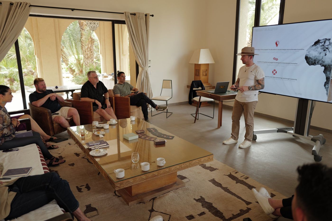 An Aliph presentation in a Marrakech villa, with participants around a low table